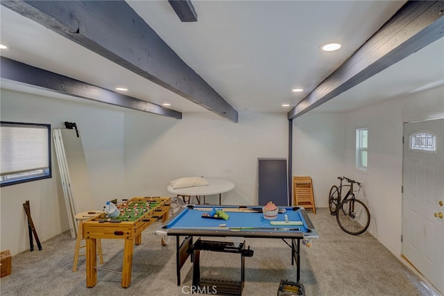 recreation room featuring carpet flooring and beam ceiling