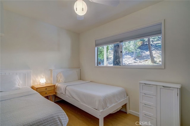 bedroom with hardwood / wood-style flooring and ceiling fan