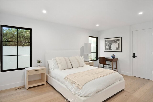 bedroom featuring light hardwood / wood-style floors