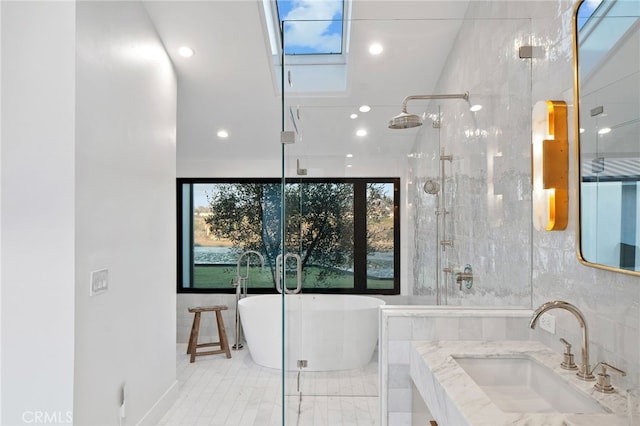 bathroom featuring plus walk in shower and vanity