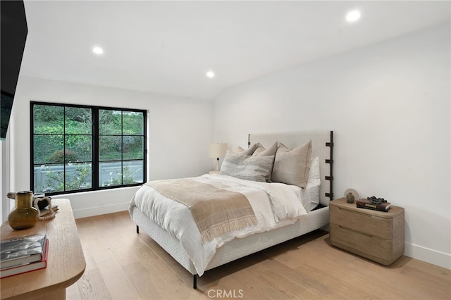 bedroom with light hardwood / wood-style floors