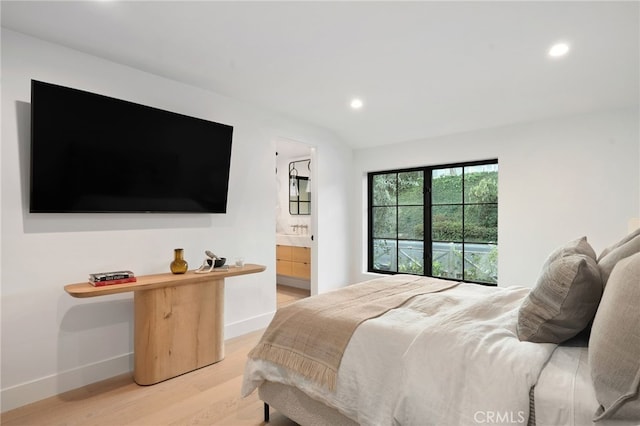 bedroom with light hardwood / wood-style flooring