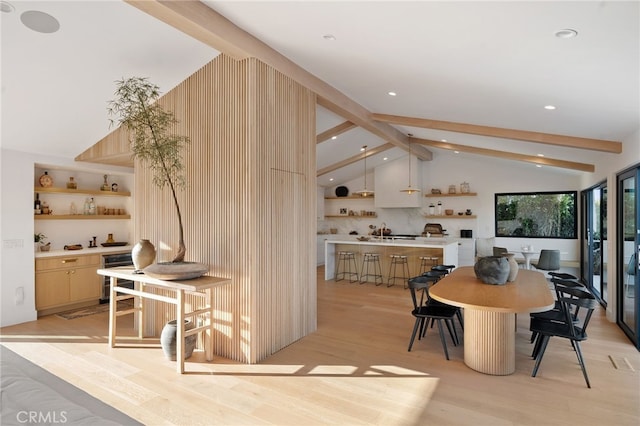 dining room with vaulted ceiling with beams, beverage cooler, and light wood-type flooring