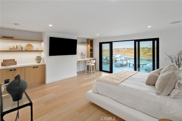 bedroom with access to outside and light hardwood / wood-style floors