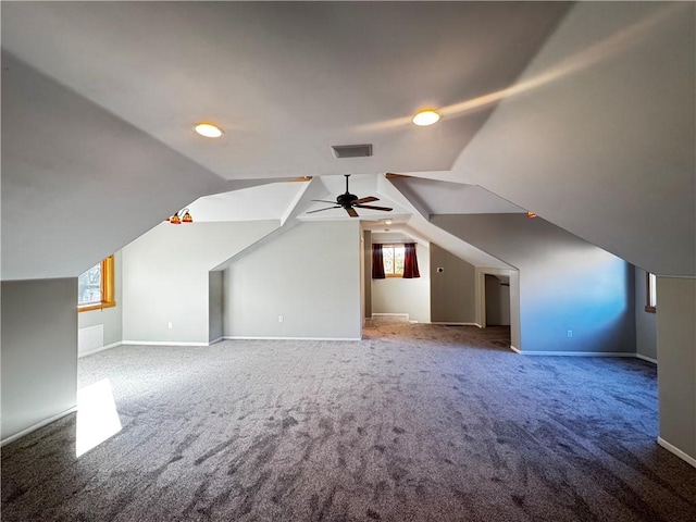 bonus room featuring lofted ceiling and carpet floors