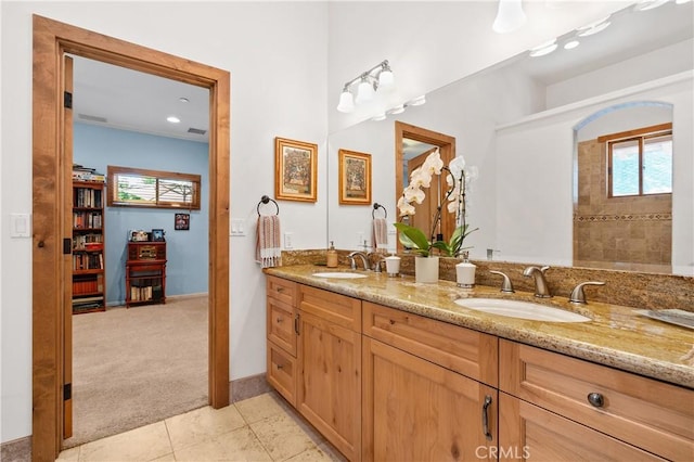 bathroom with tile patterned flooring and vanity