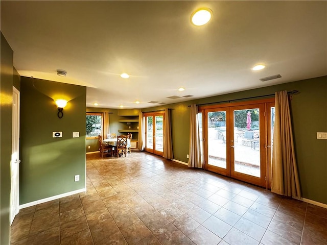 interior space with tile patterned flooring and french doors