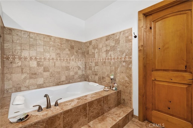 bathroom featuring tiled bath