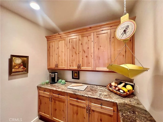 kitchen featuring light stone countertops