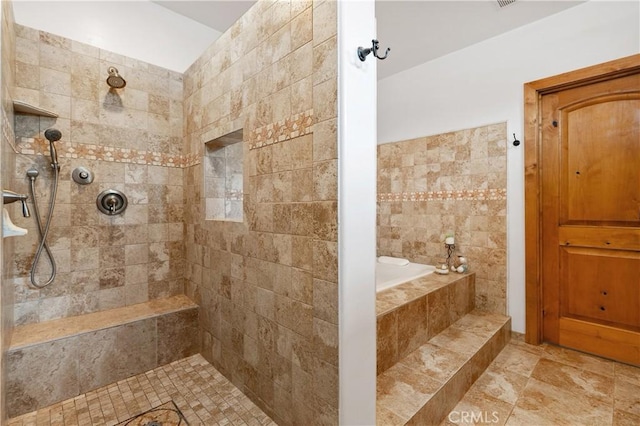 bathroom with independent shower and bath