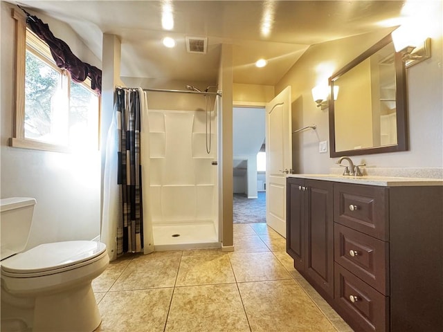 bathroom featuring tile patterned flooring, vanity, toilet, and a shower with shower curtain