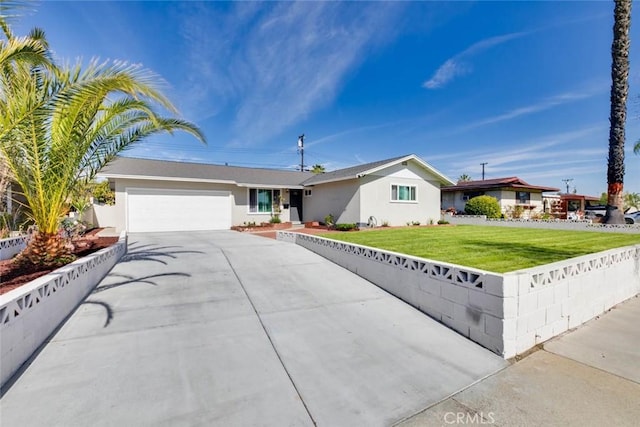 ranch-style house with a garage and a front lawn