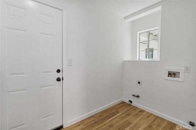 laundry room with electric dryer hookup, washer hookup, and light hardwood / wood-style floors