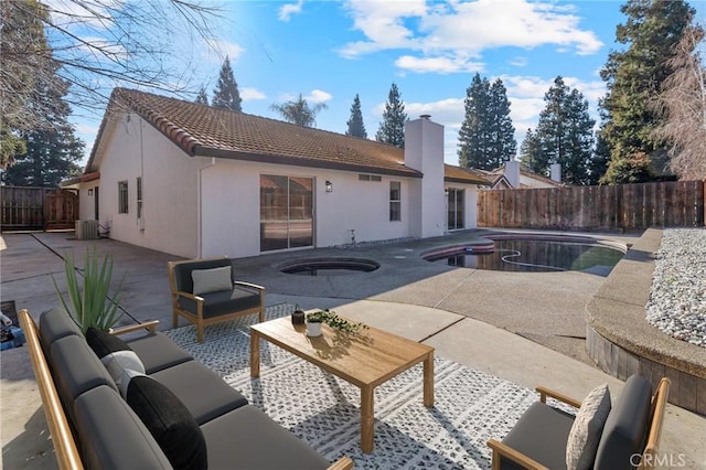 view of swimming pool featuring an in ground hot tub, a patio, and central air condition unit