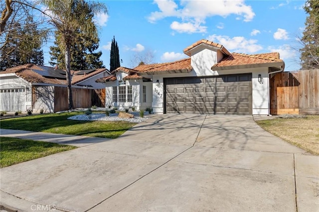 view of front of home featuring a garage and a front lawn