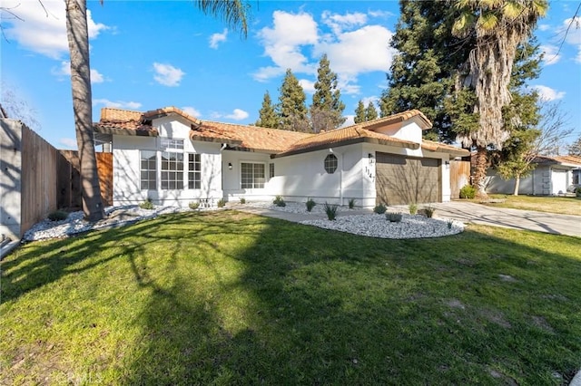 view of front of property with a garage and a front yard