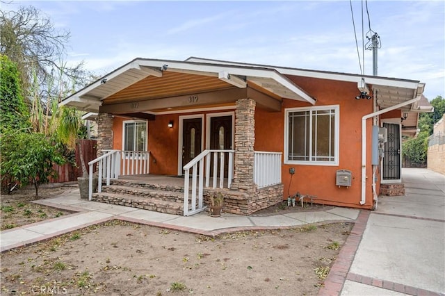 bungalow-style home featuring covered porch