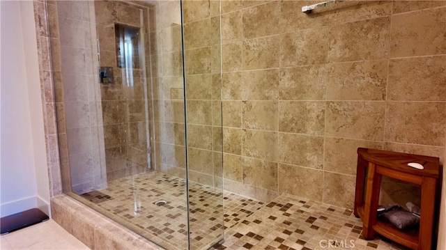 bathroom featuring tiled shower