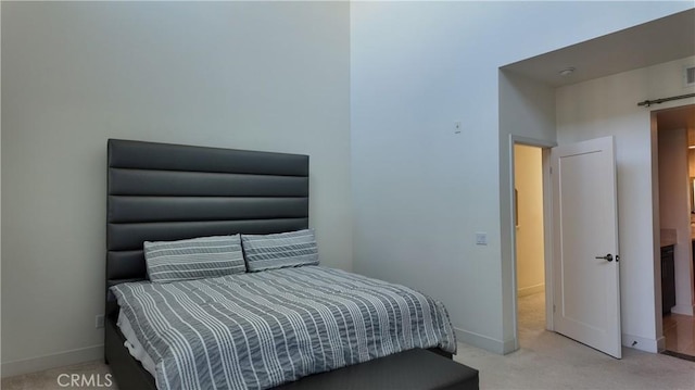 bedroom featuring light colored carpet