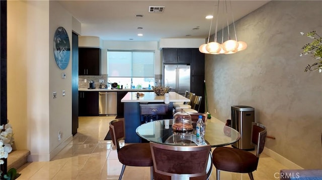 dining area featuring light tile patterned floors