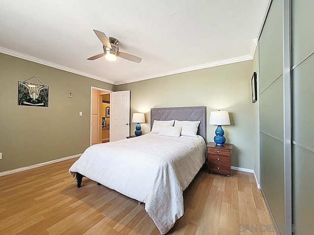 bedroom with crown molding, ceiling fan, and light wood-type flooring