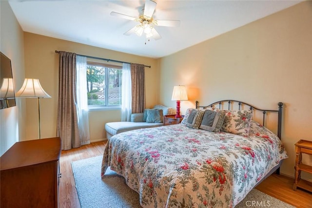 bedroom featuring light hardwood / wood-style flooring and ceiling fan