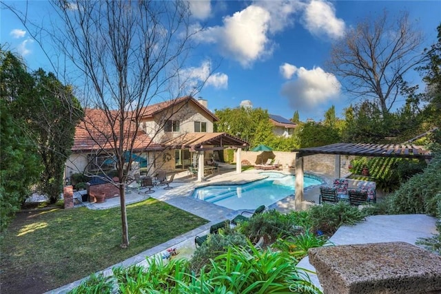 view of swimming pool featuring a pergola, a lawn, and a patio