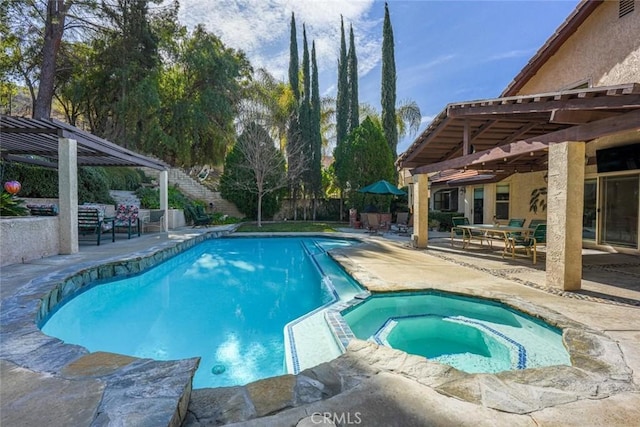 view of pool with a pergola, a patio area, and an in ground hot tub