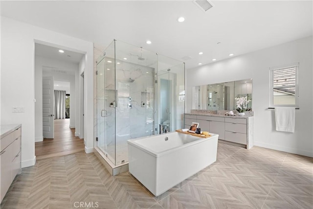 full bath featuring recessed lighting, a shower stall, visible vents, and a healthy amount of sunlight