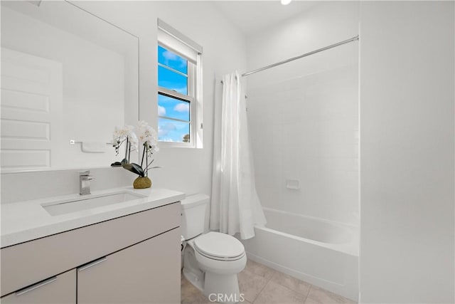 bathroom featuring toilet, tile patterned flooring, shower / bath combo, and vanity