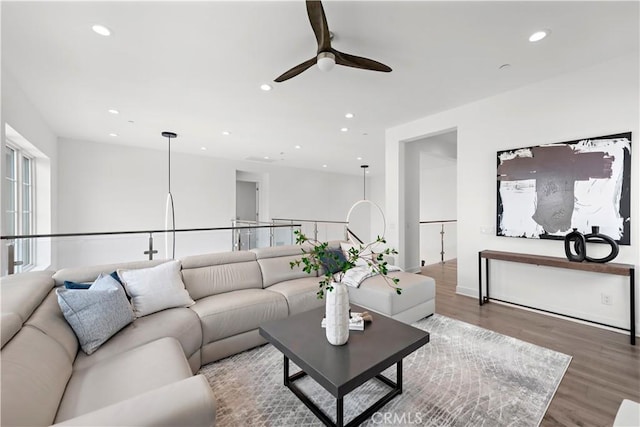 living room featuring ceiling fan, wood finished floors, and recessed lighting