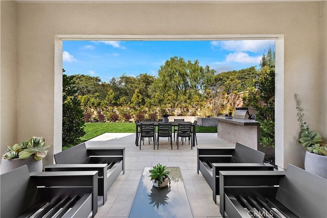 view of patio with an outdoor hangout area and outdoor dining space