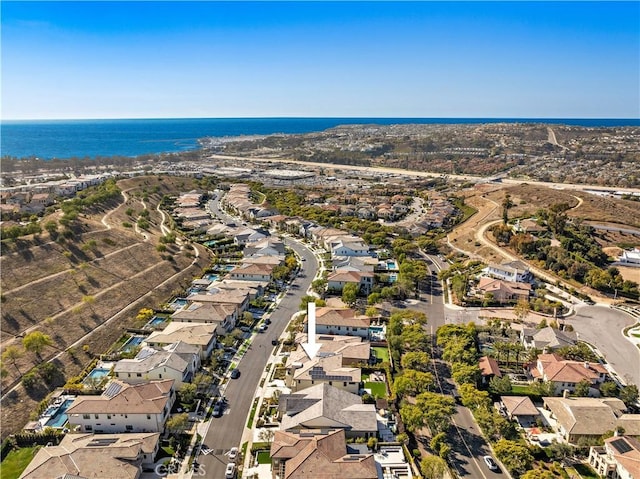 aerial view featuring a water view and a residential view