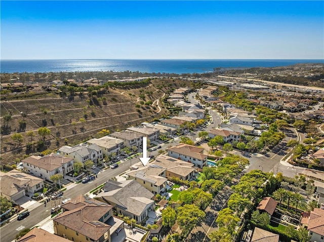 bird's eye view featuring a residential view and a water view