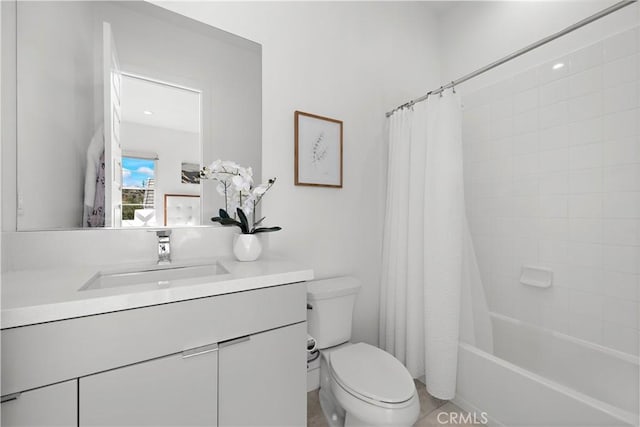 bathroom featuring shower / bath combo, vanity, and toilet