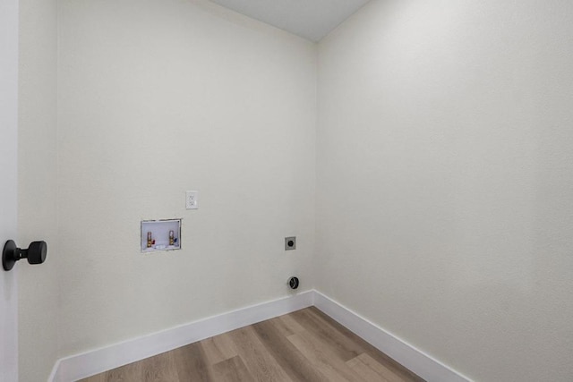 laundry area featuring electric dryer hookup, hookup for a washing machine, and hardwood / wood-style flooring