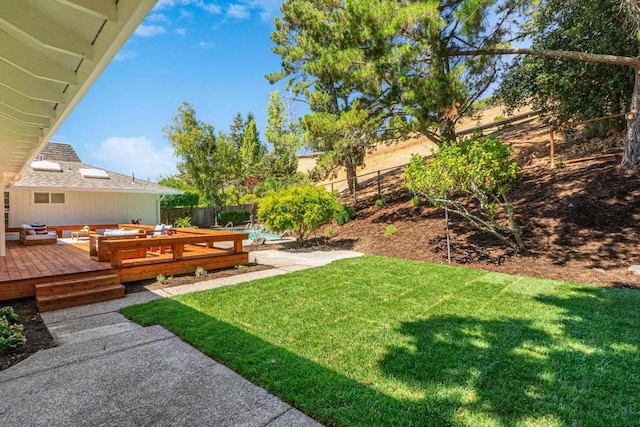 view of yard with an outdoor living space and a deck