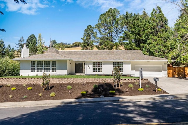 ranch-style home featuring a garage