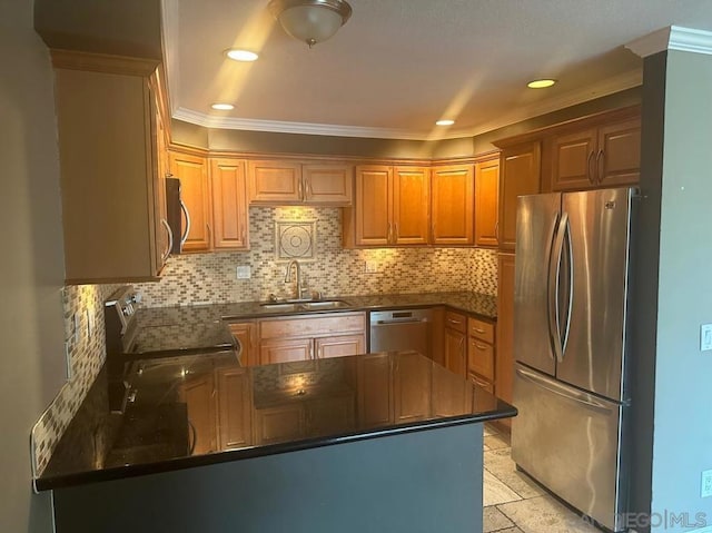 kitchen with appliances with stainless steel finishes, sink, decorative backsplash, ornamental molding, and kitchen peninsula