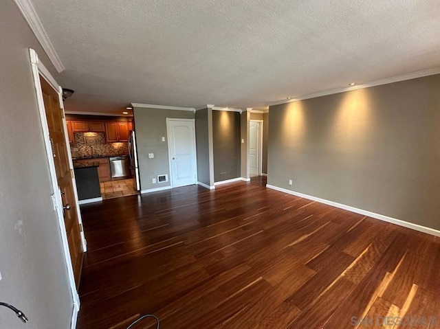 unfurnished living room with crown molding, dark hardwood / wood-style floors, and a textured ceiling