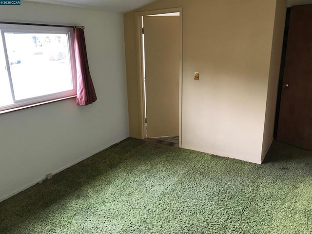 unfurnished room featuring carpet flooring