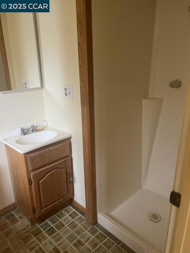 bathroom featuring vanity and walk in shower