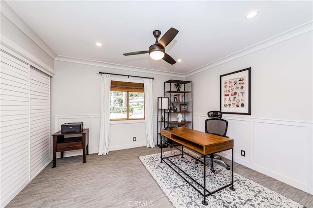 office space with ceiling fan and ornamental molding