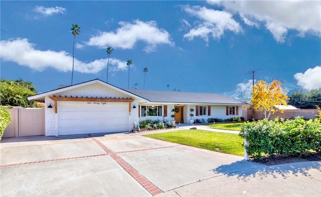 ranch-style home with a garage and a front yard