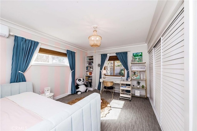 bedroom with crown molding, a wall unit AC, and a notable chandelier