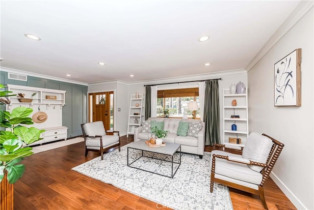 living room featuring hardwood / wood-style flooring and ornamental molding