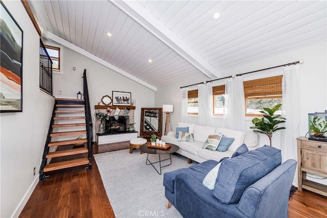 living room featuring vaulted ceiling with beams, wood ceiling, and dark wood-type flooring