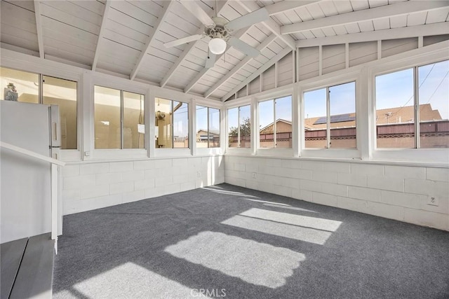 unfurnished sunroom with lofted ceiling with beams, plenty of natural light, wood ceiling, and ceiling fan