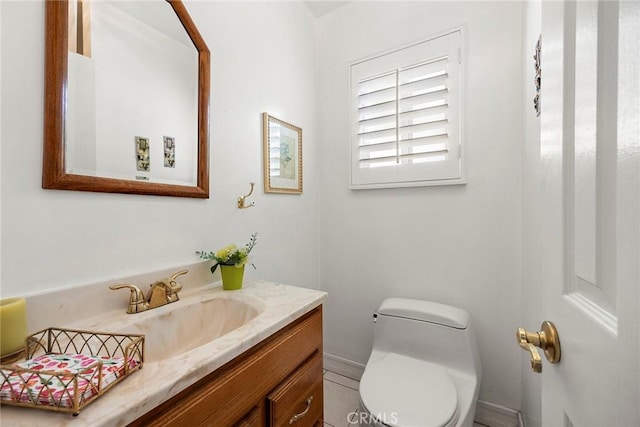 bathroom with vanity and toilet