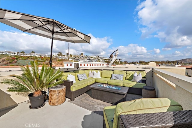 view of patio featuring a balcony and an outdoor hangout area